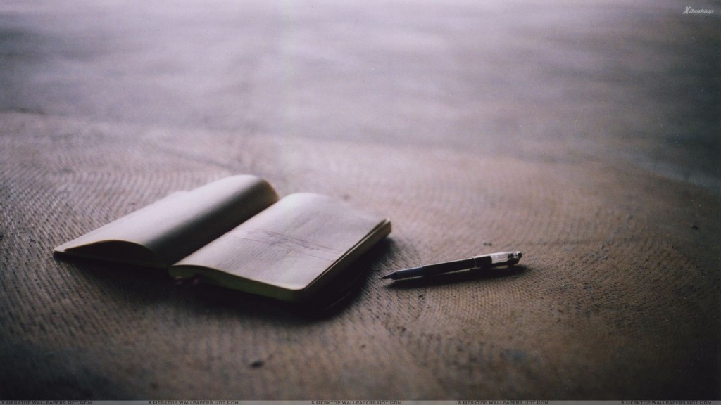 A Book And Pen On Table